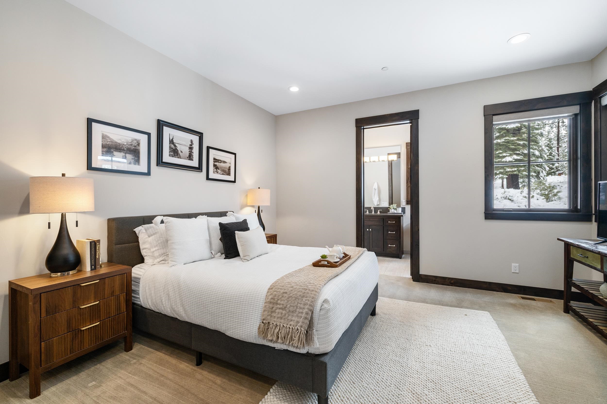 10601 Carson Range Road Truckee, CA 96161 - Photo 20 of 28 a bedroom with a bed and wooden floor