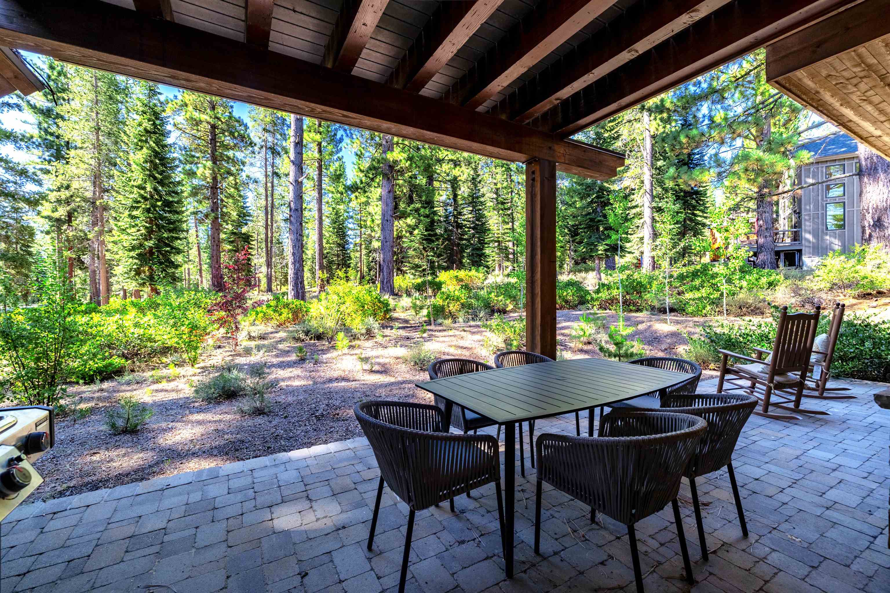 10601 Carson Range Road Truckee, CA 96161 - Photo 26 of 28 a view of a patio with table and chairs and potted plants