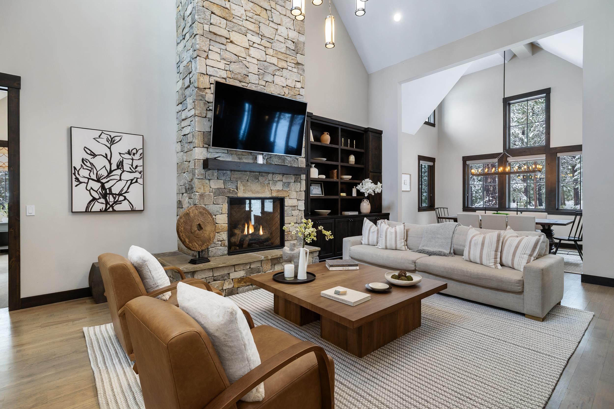 10601 Carson Range Road Truckee, CA 96161 - Photo 5 of 28 a living room with furniture a fireplace and a flat screen tv