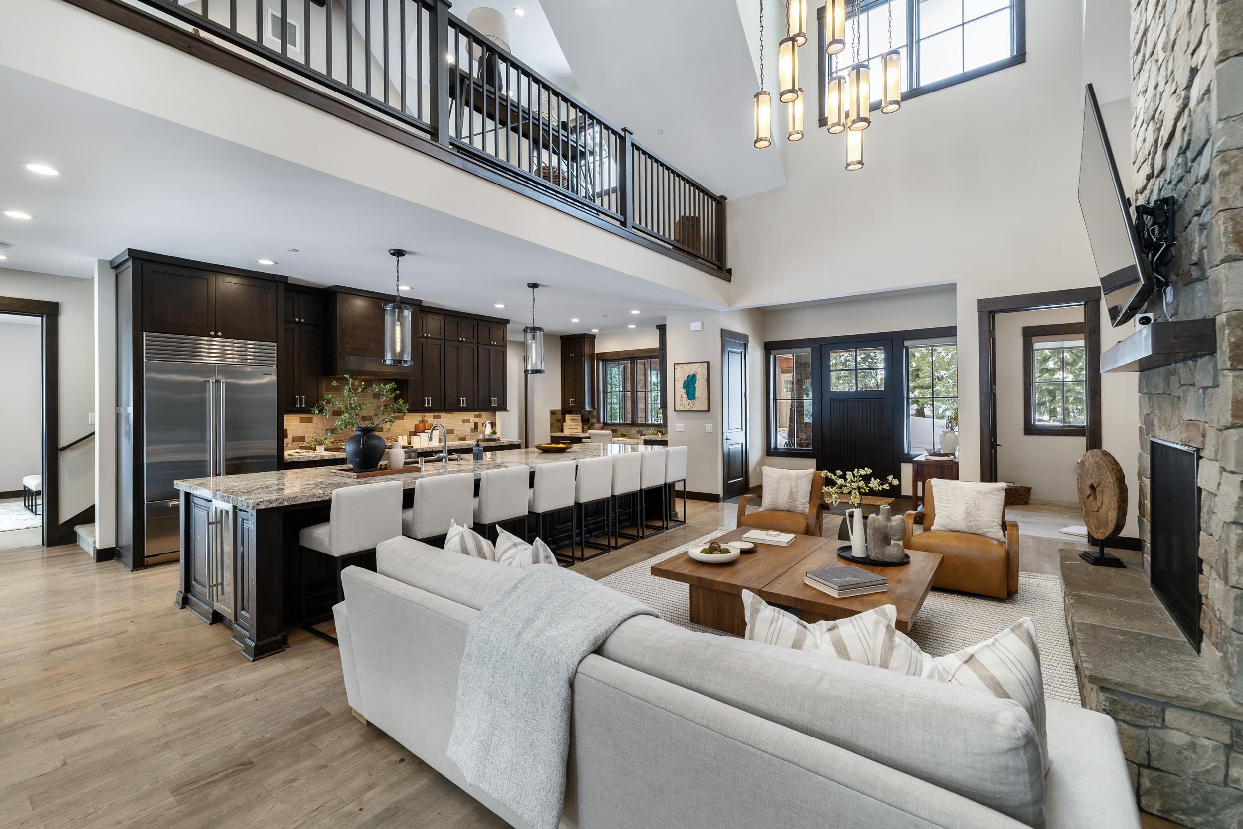 10601 Carson Range Road Truckee, CA 96161 - Photo 6 of 28 a living room with furniture kitchen view and a chandelier