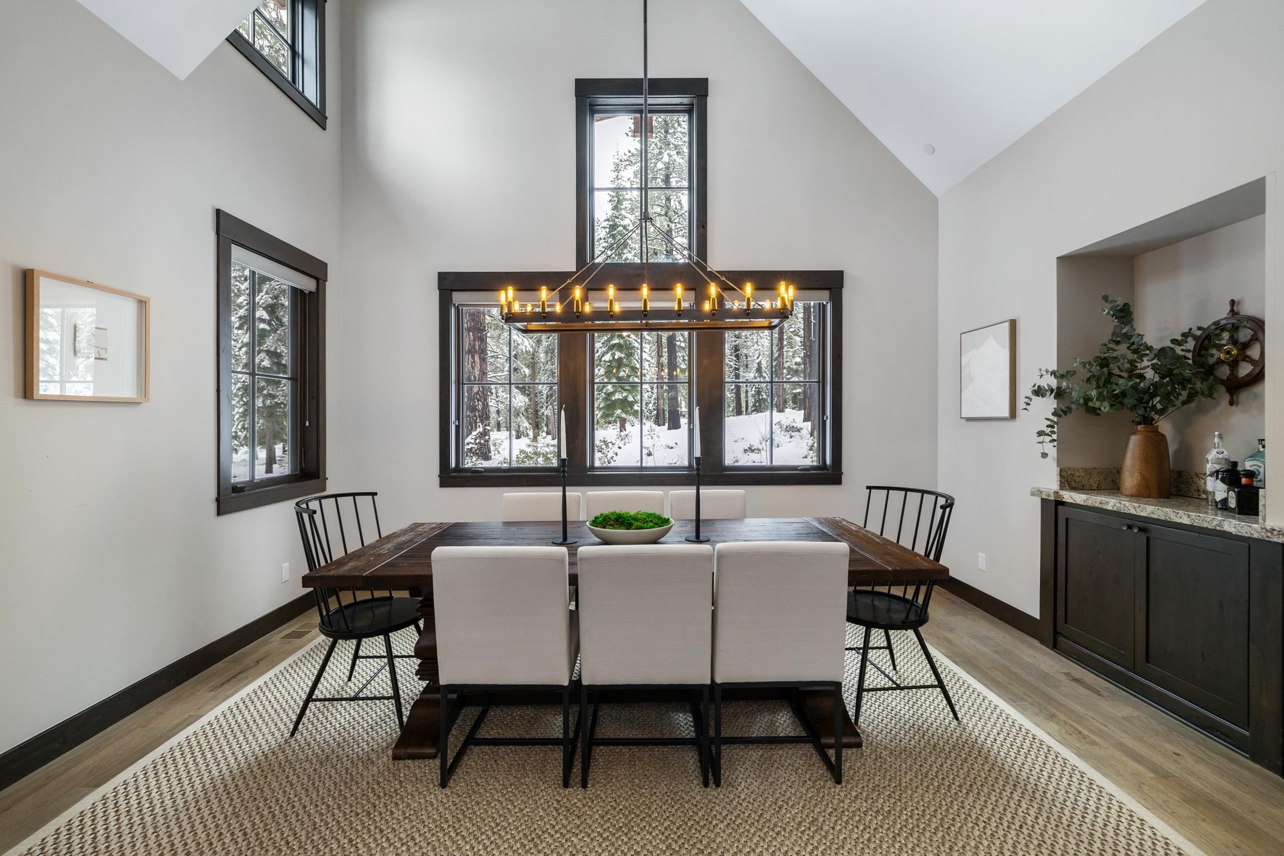 10601 Carson Range Road Truckee, CA 96161 - Photo 8 of 28 a view of a dining room with furniture window and wooden floor