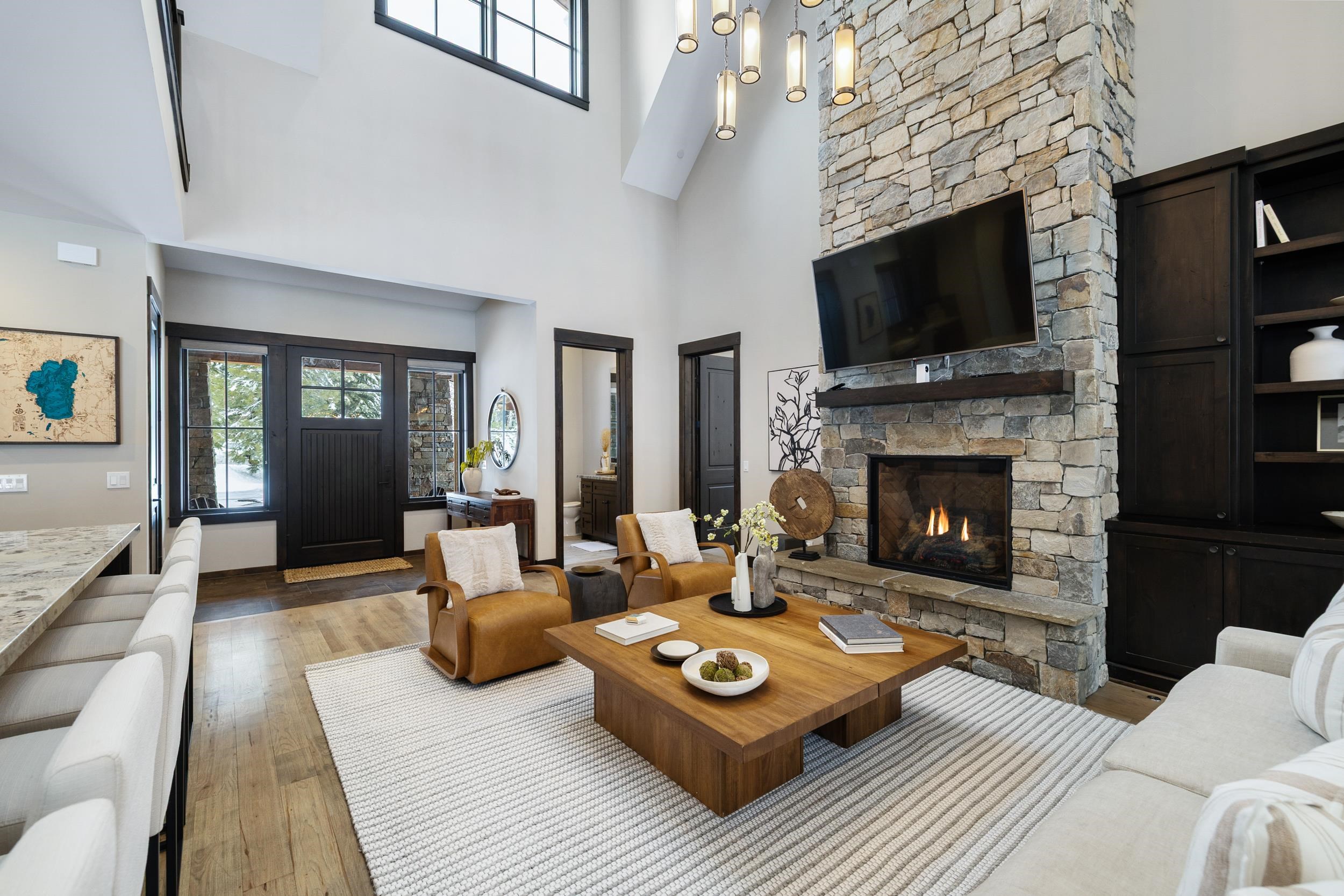 10601 Carson Range Road Truckee, CA 96161 - Photo 10 of 28 a living room with furniture a flat screen tv and a fireplace