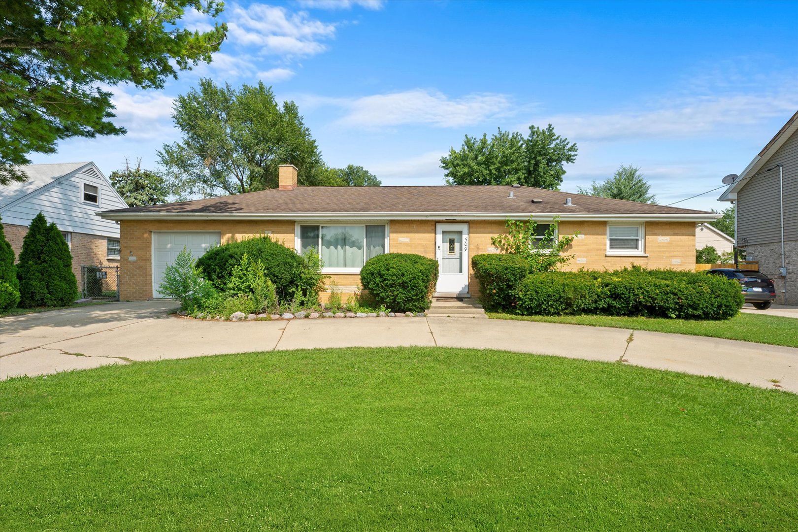 a house view with a garden space