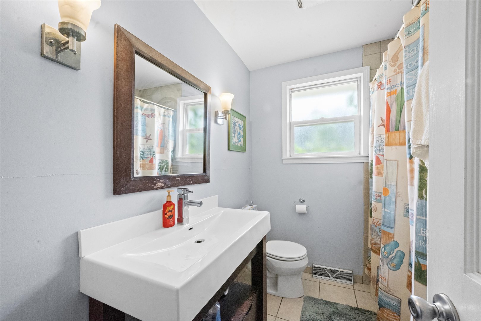 509 Spring Street Roselle, IL 60172 - Photo 12 of 31 a bathroom with a sink toilet and shower