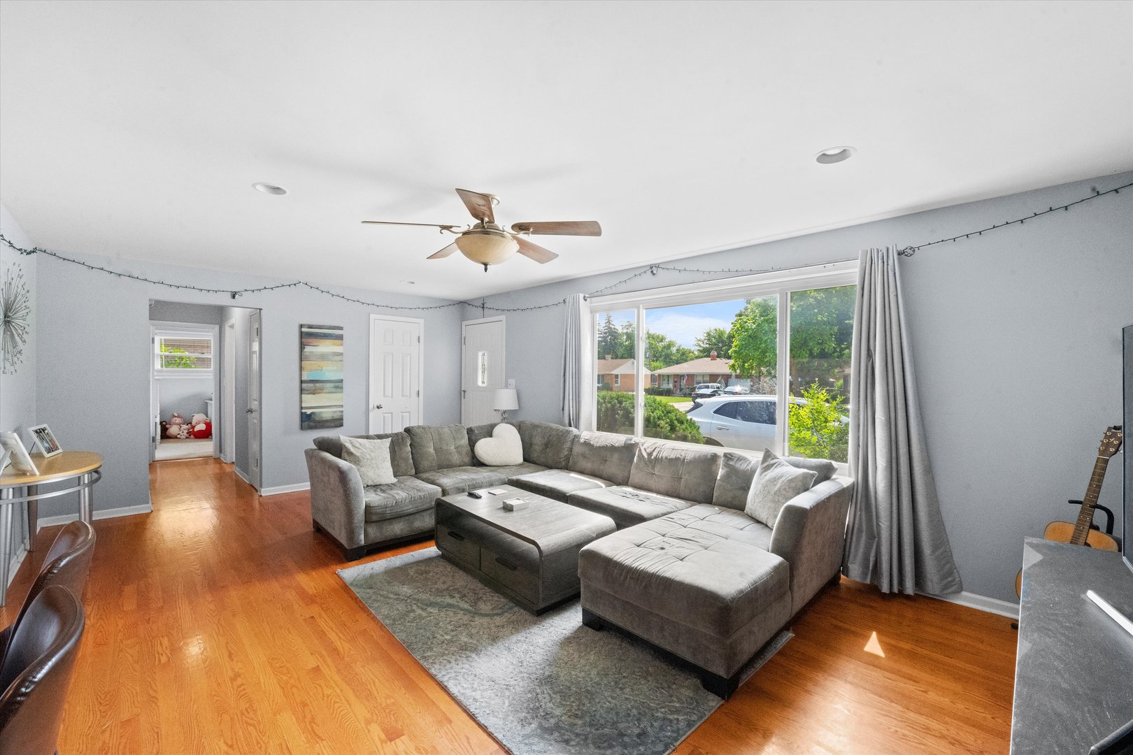 509 Spring Street Roselle, IL 60172 - Photo 2 of 31 a living room with furniture and a large window