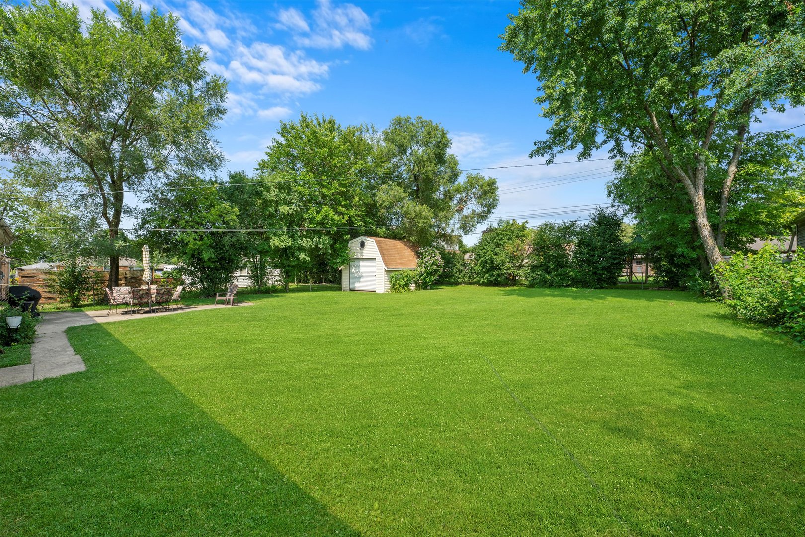 509 Spring Street Roselle, IL 60172 - Photo 25 of 31 a view of a garden with trees