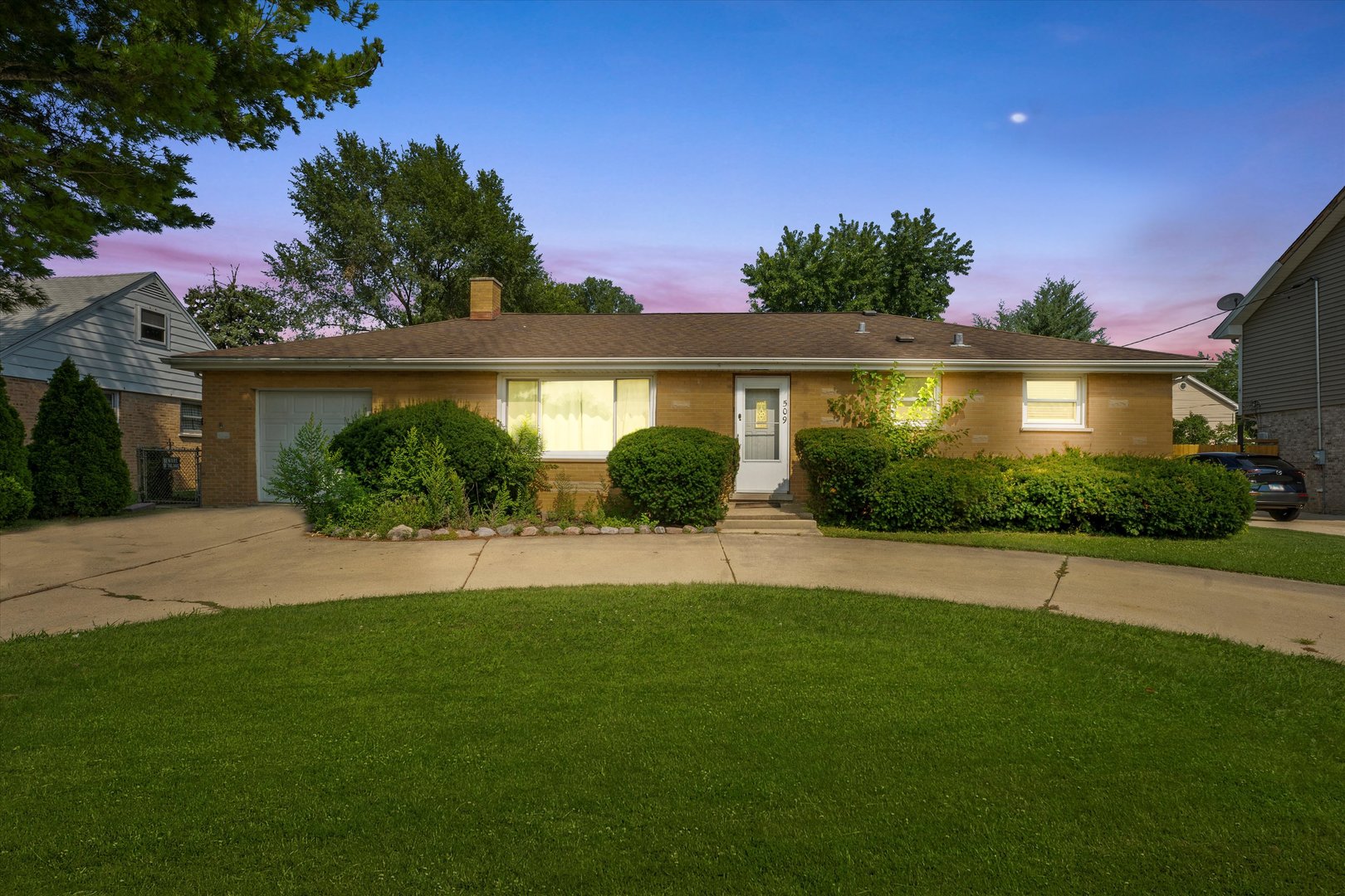 509 Spring Street Roselle, IL 60172 - Photo 29 of 31 a front view of a house with a yard and potted plants