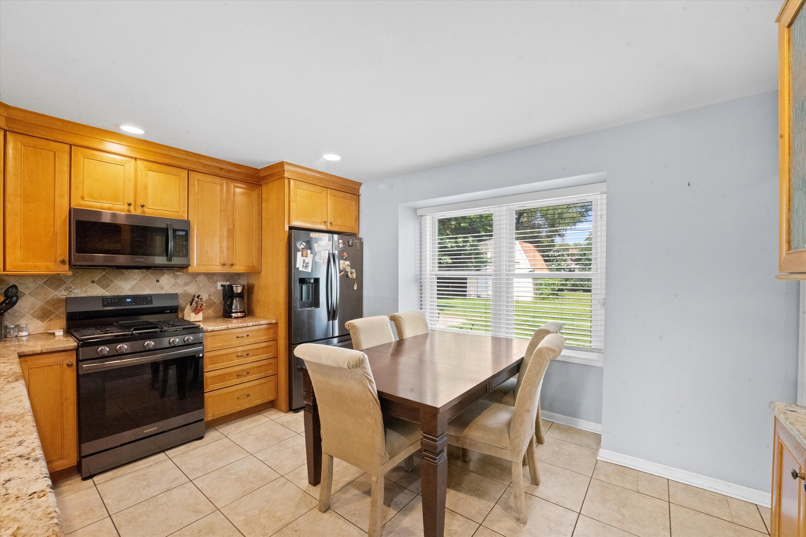 509 Spring Street Roselle, IL 60172 - Photo 6 of 31 a view of a dining room with furniture window and outside view