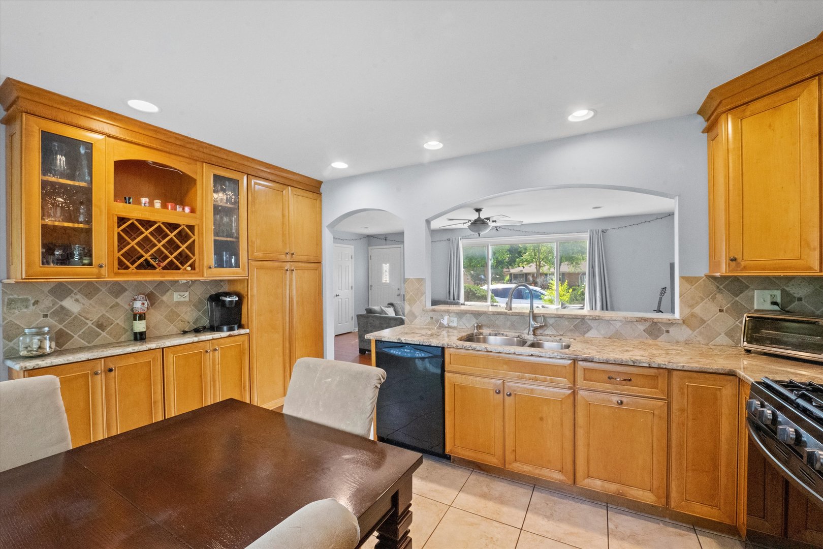 509 Spring Street Roselle, IL 60172 - Photo 8 of 31 a kitchen with a sink stove and cabinets