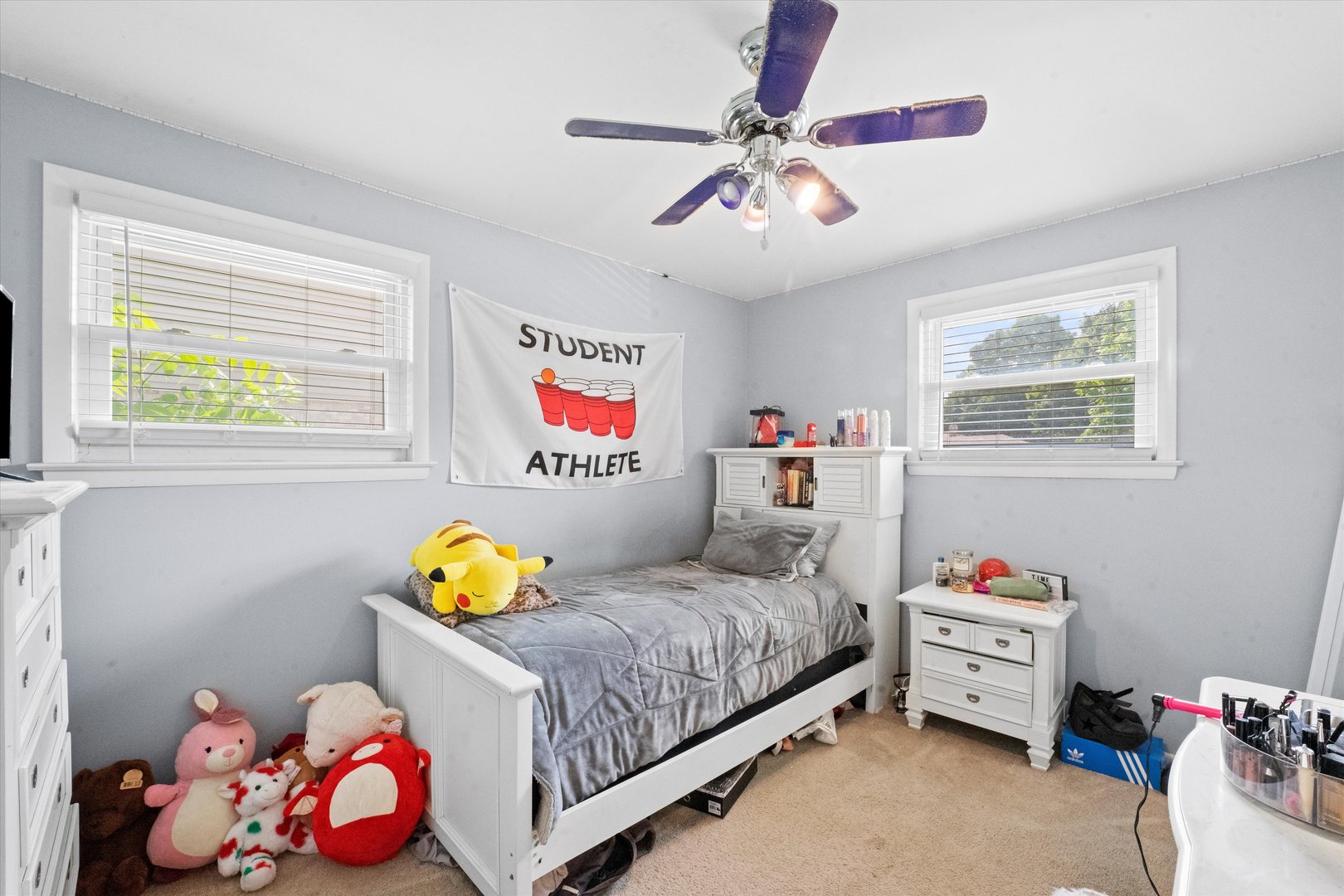 509 Spring Street Roselle, IL 60172 - Photo 10 of 31 a bedroom with a bed and a chandelier