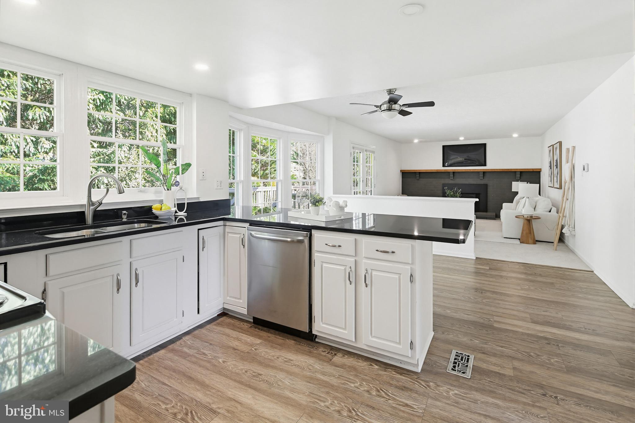 4608 Old Dragon Path Ellicott City, MD 21042 - Photo 12 of 60 a kitchen with a sink window and cabinets