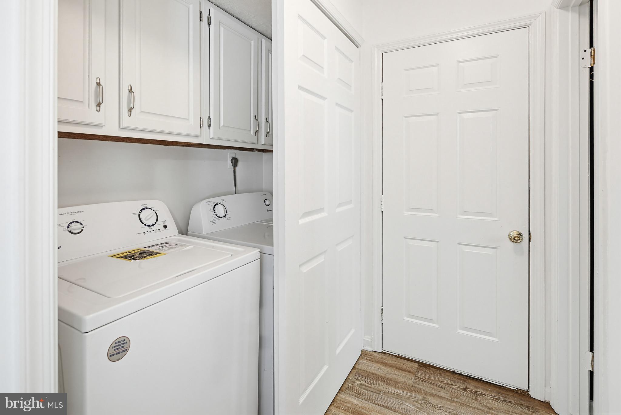 4608 Old Dragon Path Ellicott City, MD 21042 - Photo 20 of 60 a view of a storage and utility room with washer and dryer