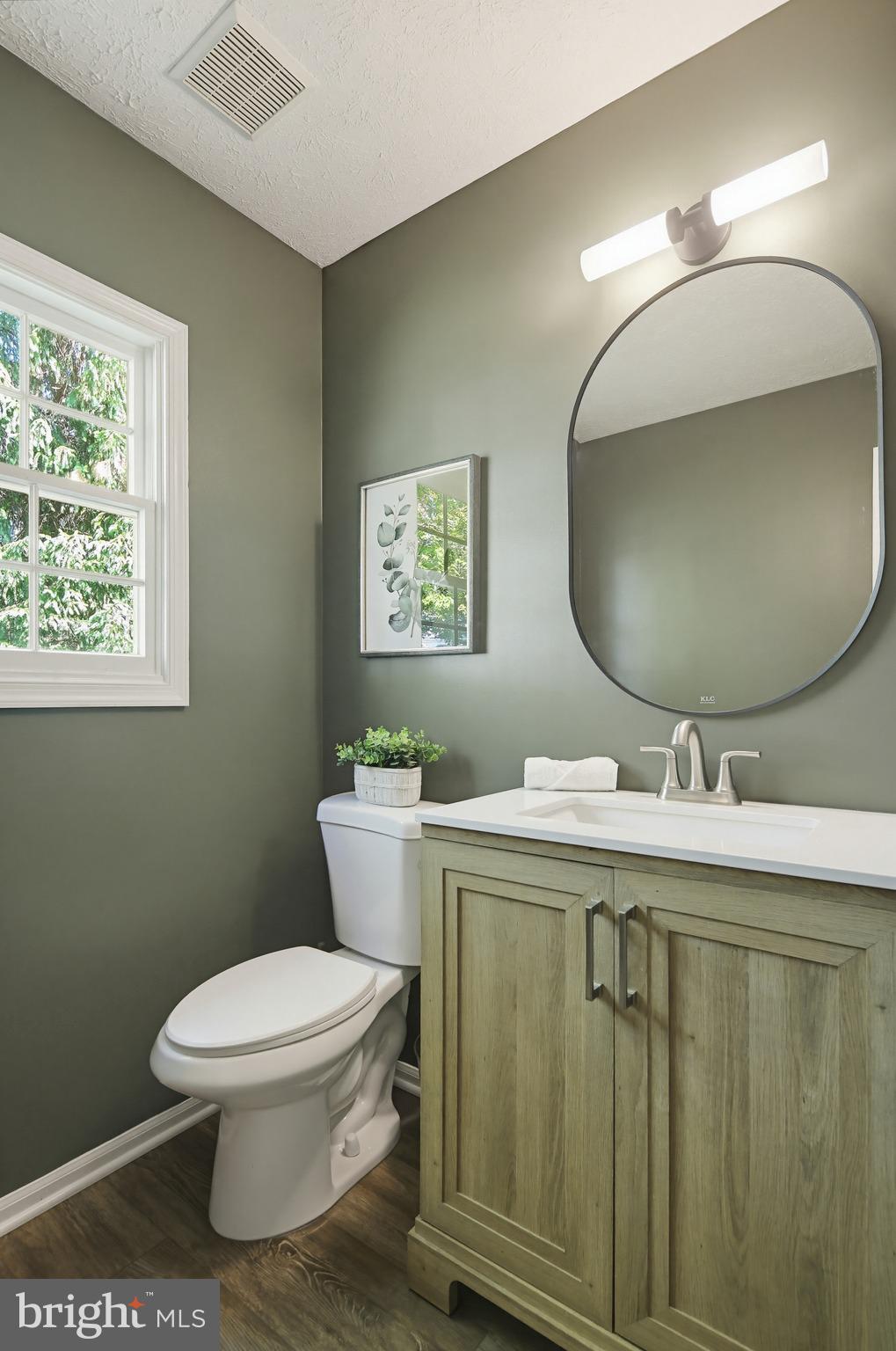 4608 Old Dragon Path Ellicott City, MD 21042 - Photo 22 of 60 a bathroom with a toilet sink and mirror
