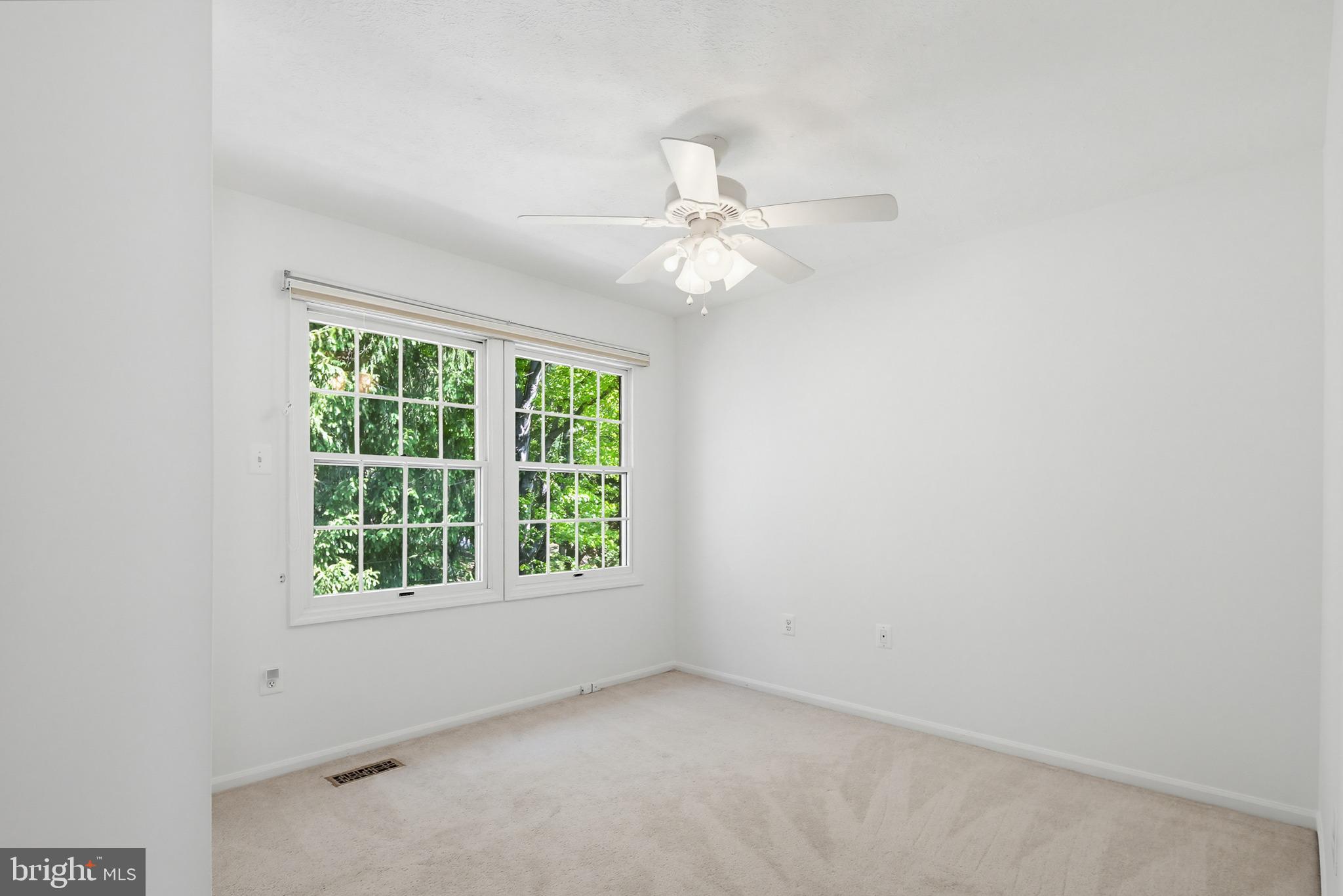 4608 Old Dragon Path Ellicott City, MD 21042 - Photo 37 of 60 an empty room with a window and a fan