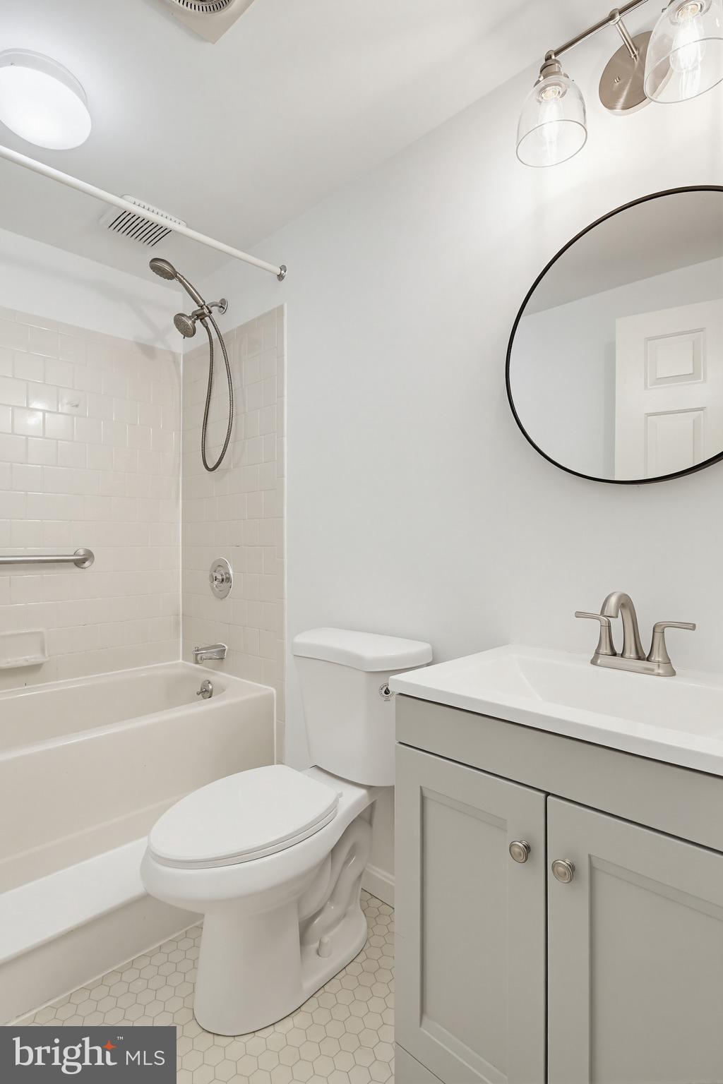 4608 Old Dragon Path Ellicott City, MD 21042 - Photo 50 of 60 a bathroom with a sink a toilet and a mirror