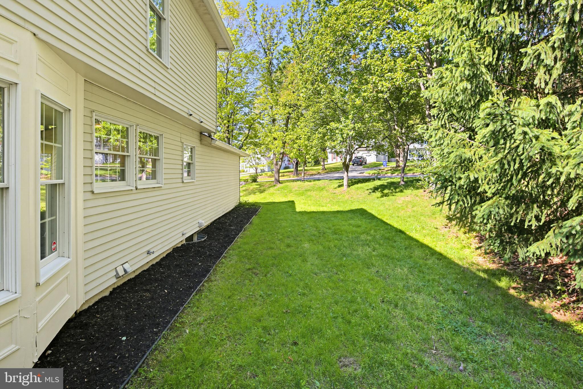 4608 Old Dragon Path Ellicott City, MD 21042 - Photo 58 of 60 a view of a backyard with plants and large trees