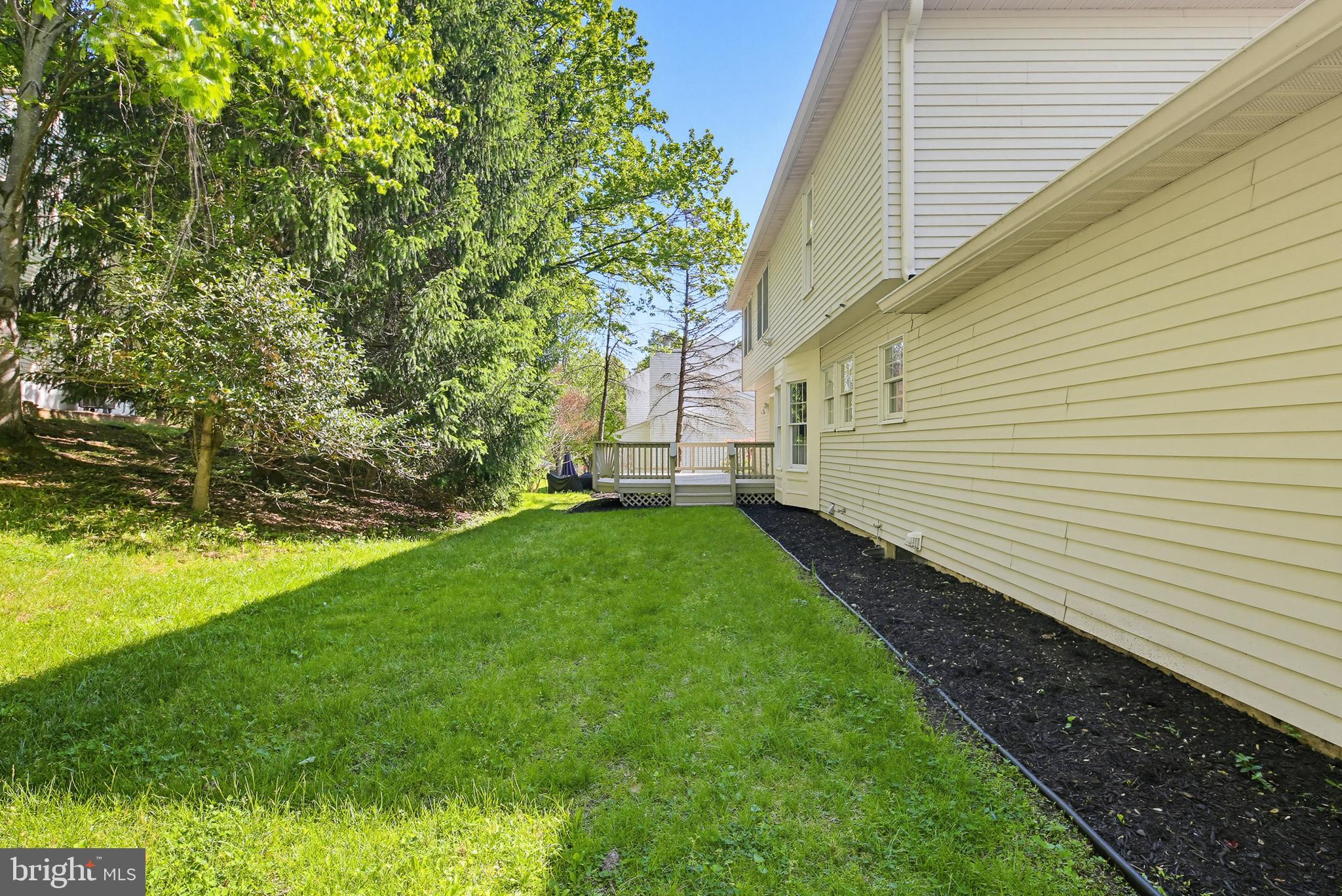 4608 Old Dragon Path Ellicott City, MD 21042 - Photo 60 of 60 a view of a backyard with plants and large trees