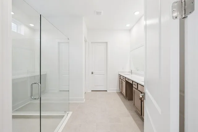 a spacious bathroom with a bathtub and a shower