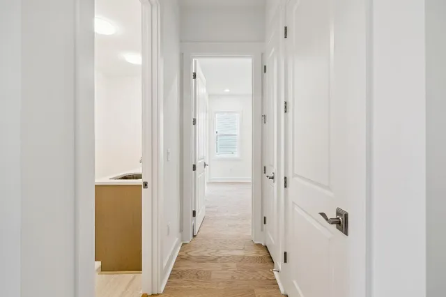 a view of a bathroom from a hallway