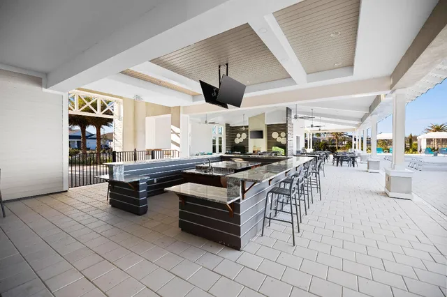 a living room with lots of furniture and a table