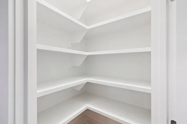 a empty closet with white paint