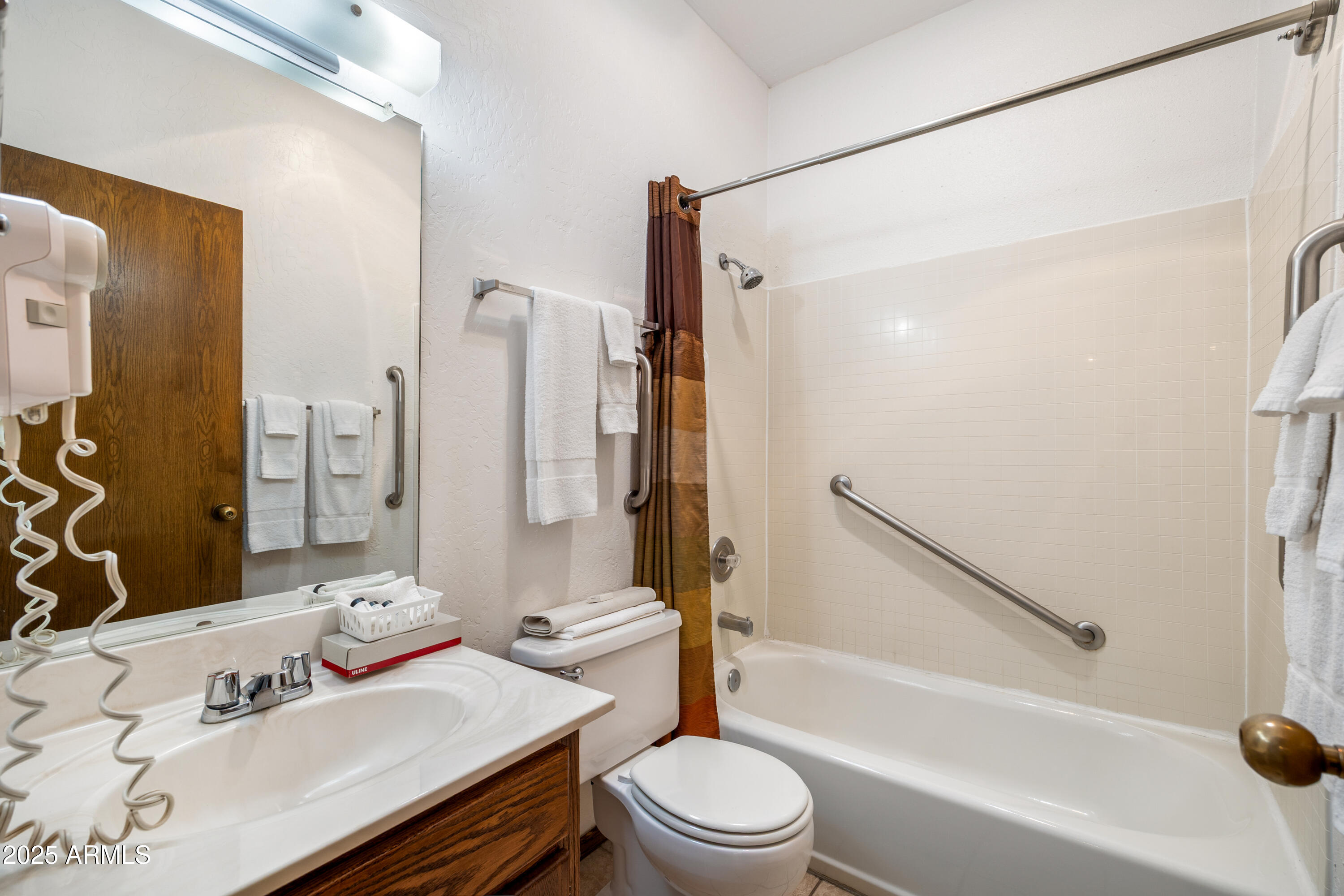 5829 East Buck Springs Road, Unit 255 Pinetop, AZ 85935 - Photo 13 of 21 a bathroom with a sink toilet and shower