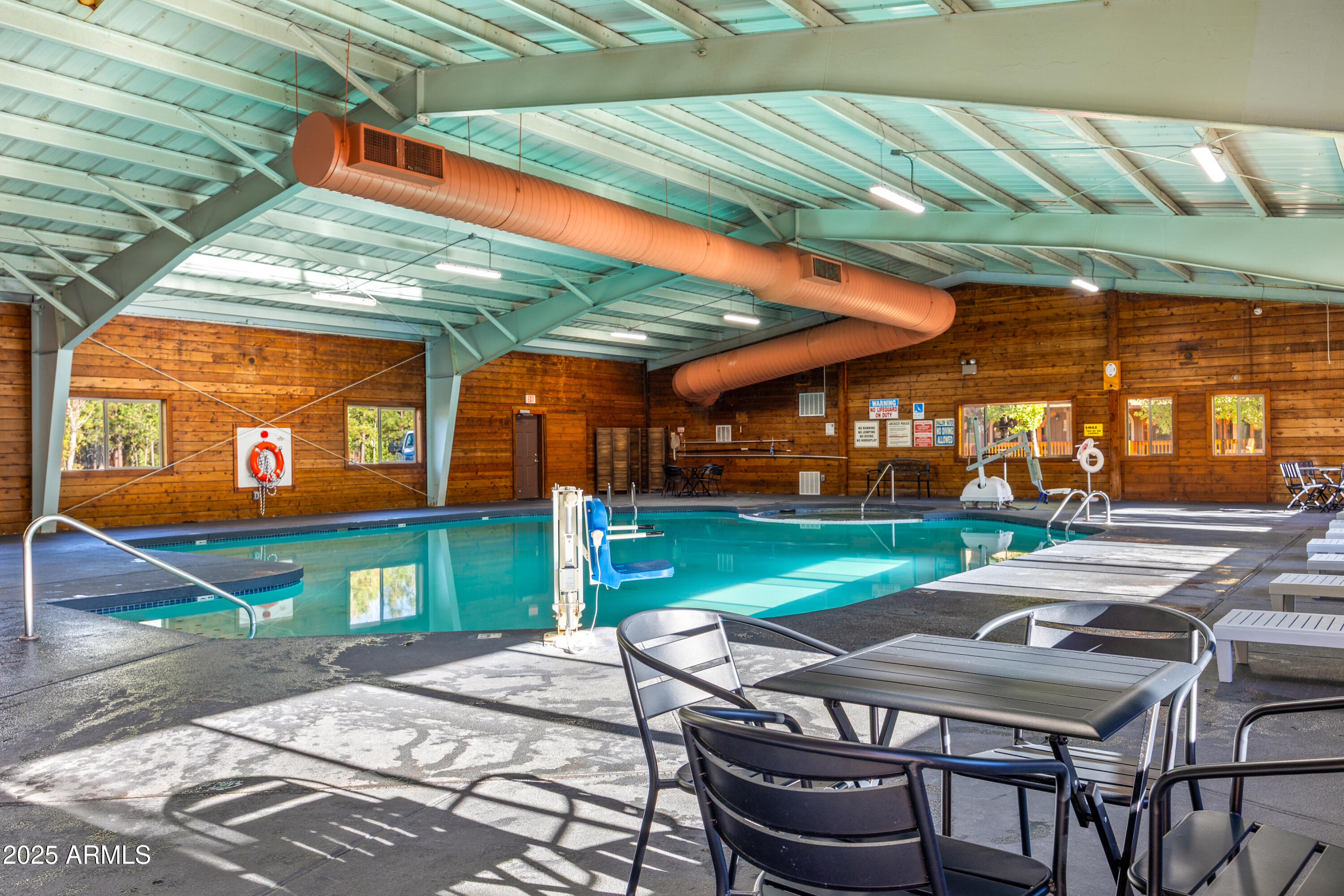 5829 East Buck Springs Road, Unit 255 Pinetop, AZ 85935 - Photo 15 of 21 a patio with a table and chairs and a barbeque