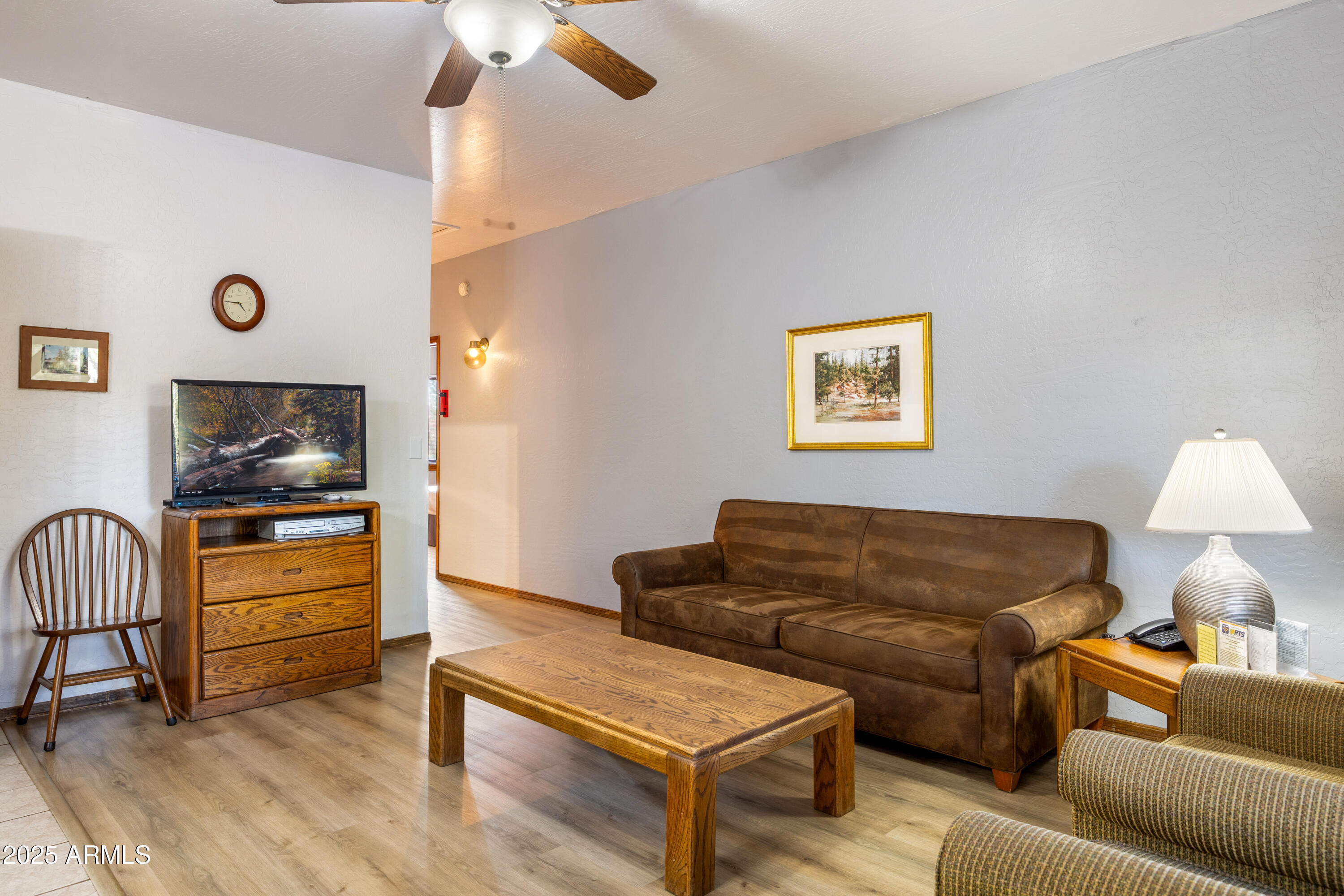5829 East Buck Springs Road, Unit 255 Pinetop, AZ 85935 - Photo 3 of 21 a living room with furniture and a flat screen tv
