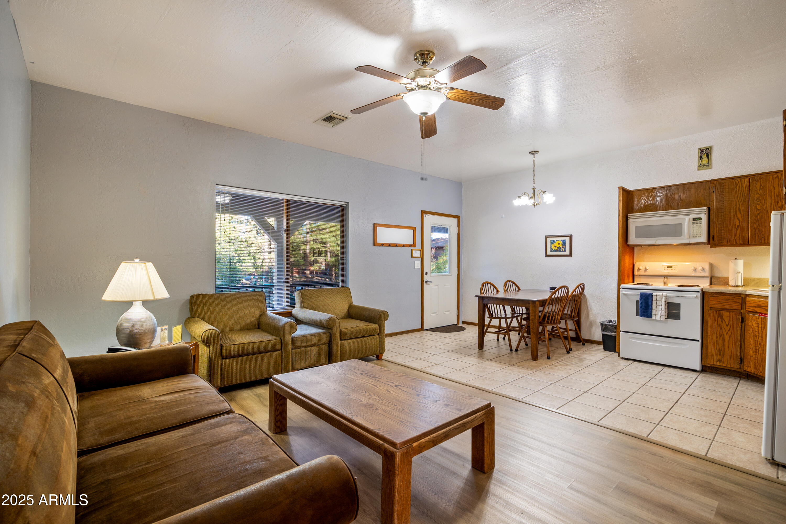 5829 East Buck Springs Road, Unit 255 Pinetop, AZ 85935 - Photo 4 of 21 a living room with furniture and wooden floor