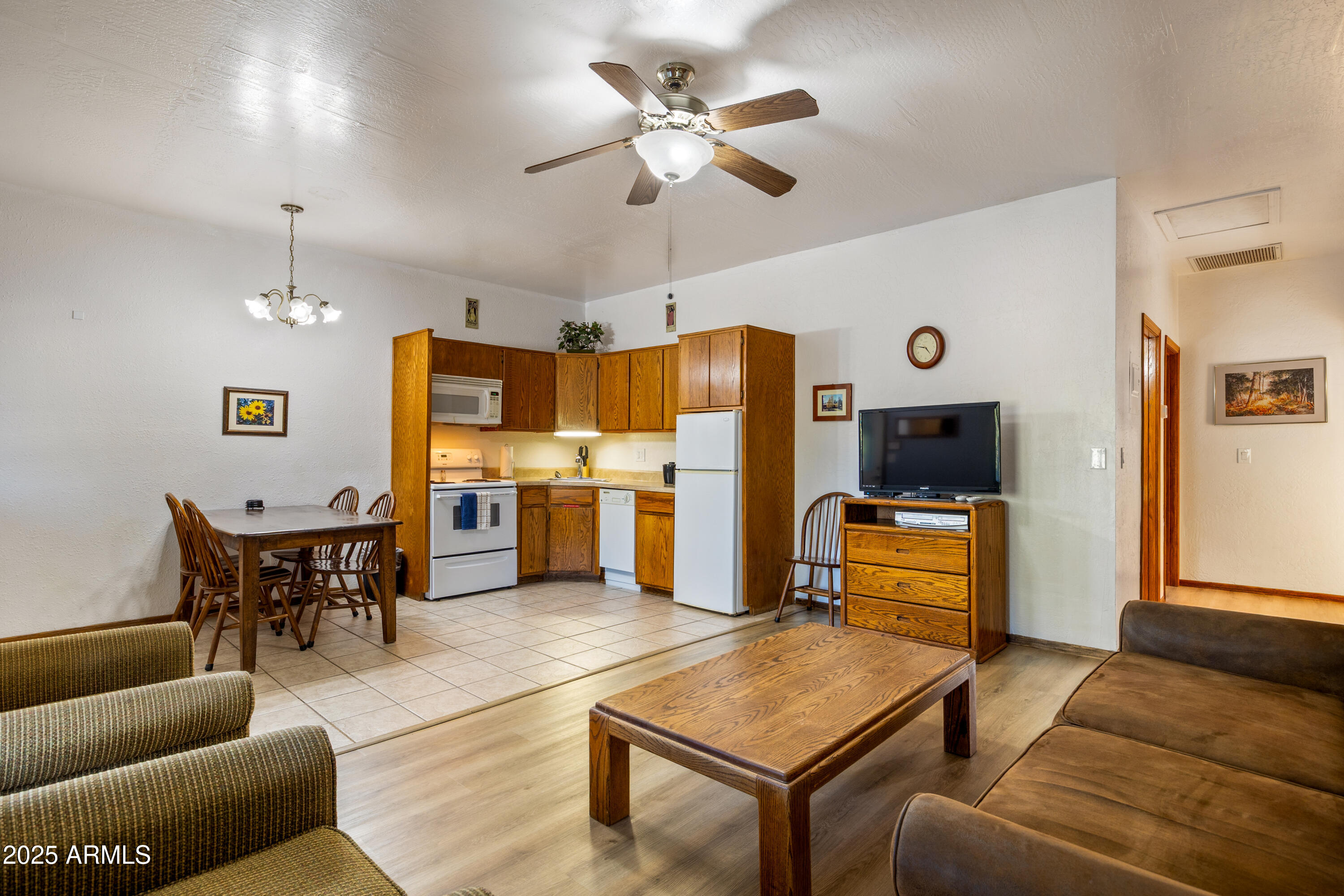 5829 East Buck Springs Road, Unit 255 Pinetop, AZ 85935 - Photo 6 of 21 a living room with furniture kitchen view and a wooden floor