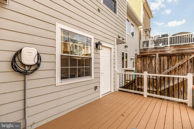a view of a brick house with a large window