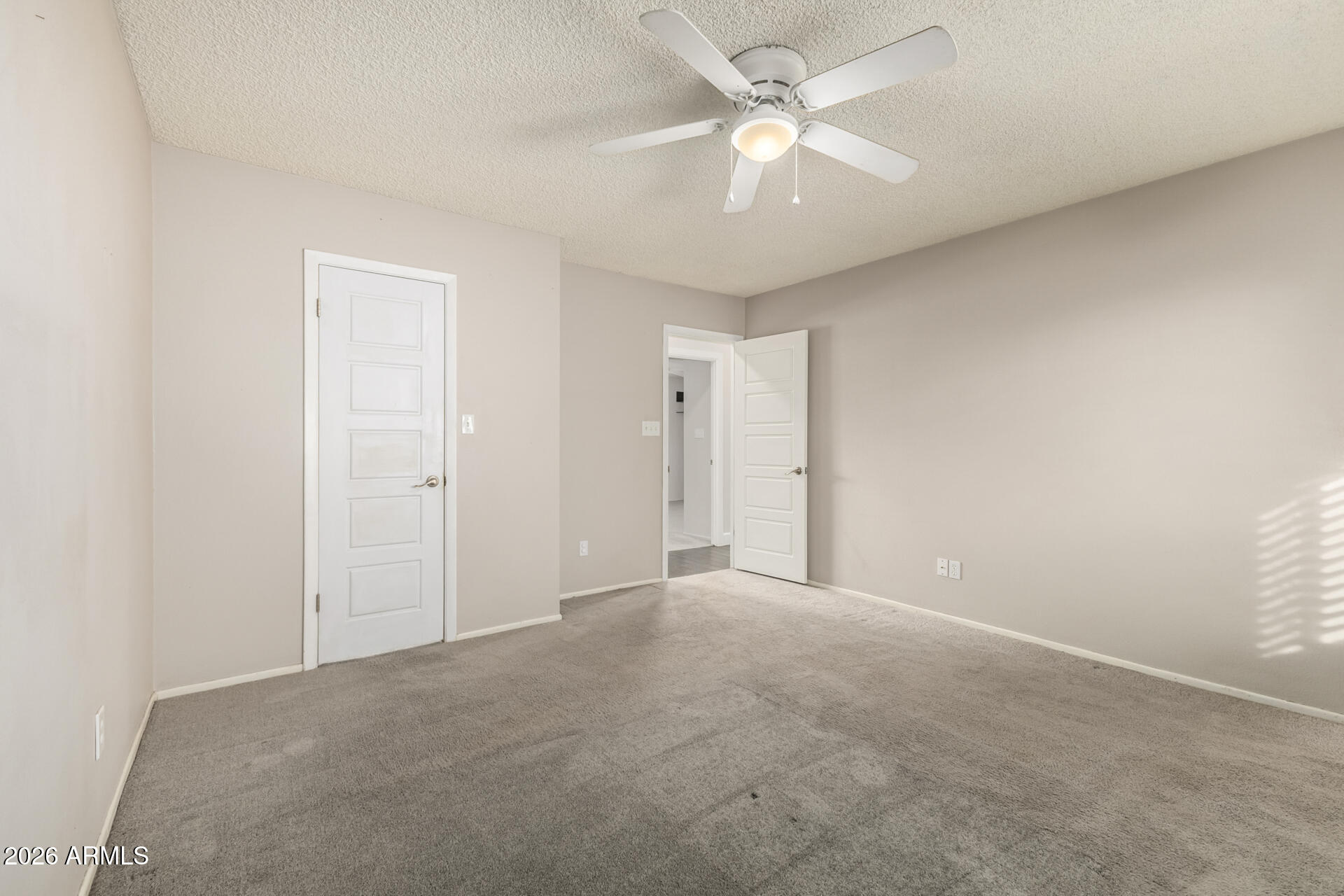 1649 West Royal Palm Road Phoenix, AZ 85021 - Photo 16 of 32 an empty room with fan and a ceiling fan