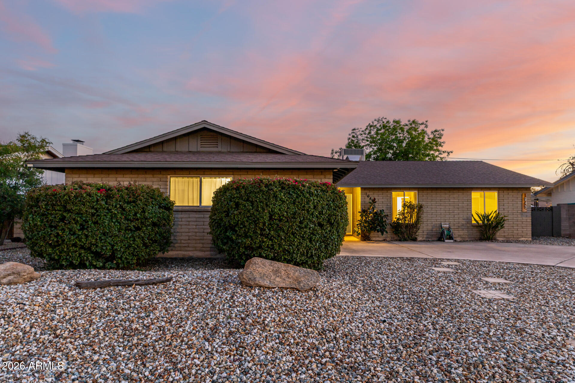 1649 West Royal Palm Road Phoenix, AZ 85021 - Photo 2 of 32 a front view of a house with garden