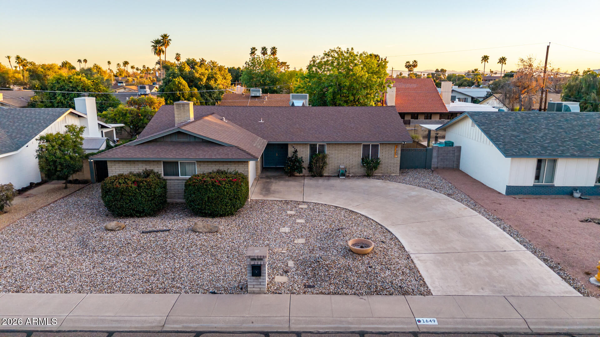 1649 West Royal Palm Road Phoenix, AZ 85021 - Photo 27 of 32 a front view of a house with garden