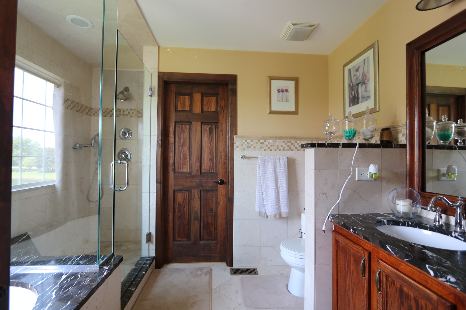 1594 Baytree Drive Romeoville, IL 60446 - Photo 14 of 32 a bathroom with a sink a toilet and shower