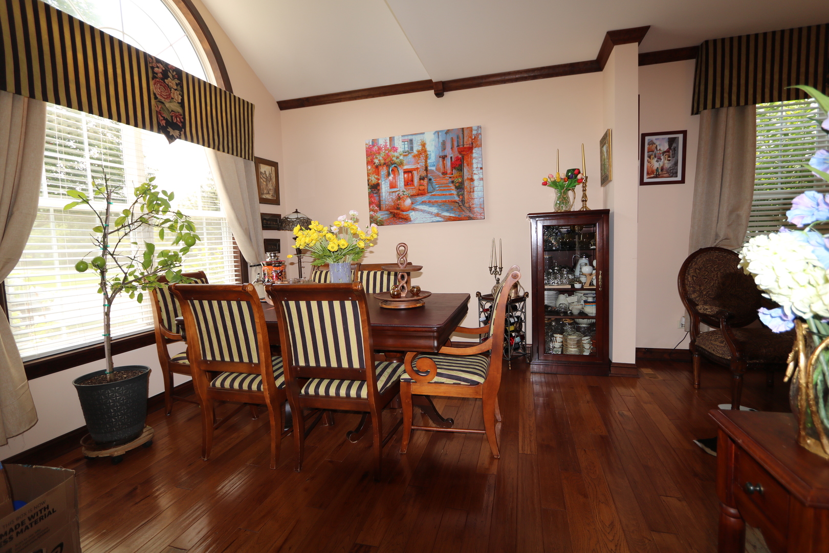 1594 Baytree Drive Romeoville, IL 60446 - Photo 5 of 32 a view of a dining room with furniture and wooden floor