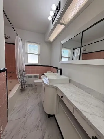 a view of a hallway with washer and dryer