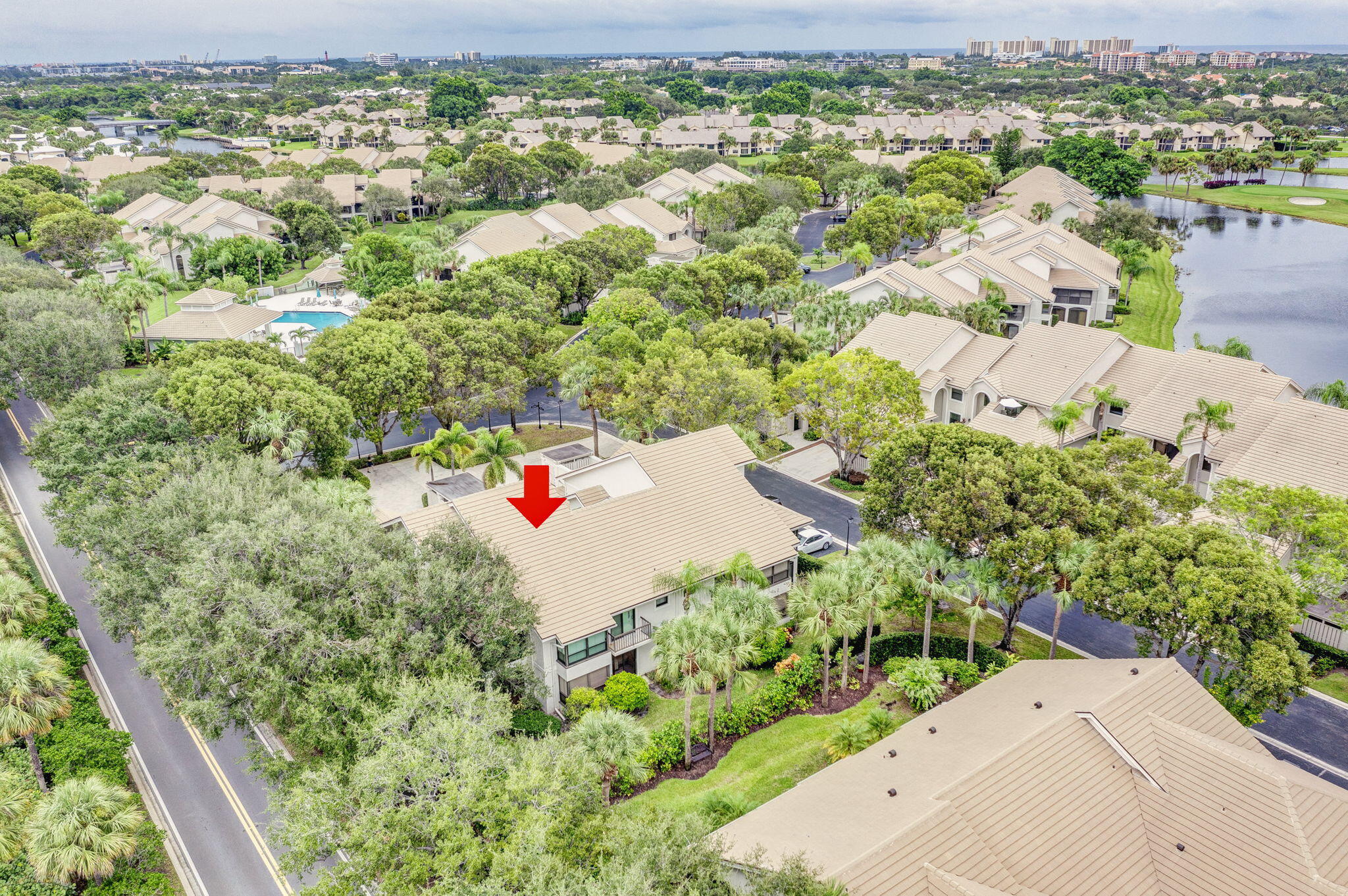 16151 West Bay Drive, Unit 161 Jupiter, FL 33477 - Photo 2 of 25 an aerial view of residential houses with outdoor space