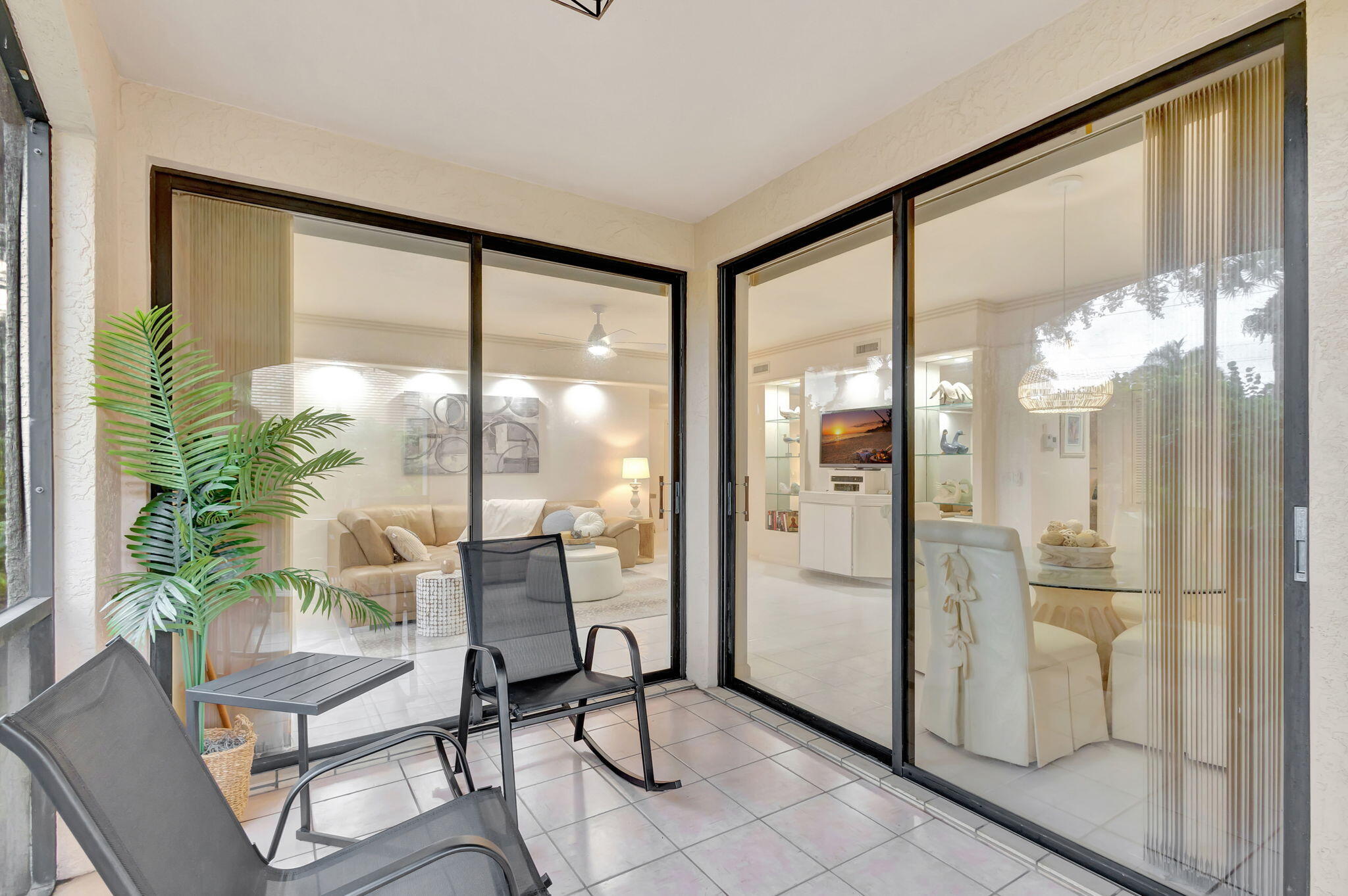 16151 West Bay Drive, Unit 161 Jupiter, FL 33477 - Photo 23 of 25 a view of a livingroom with furniture and a floor to ceiling window