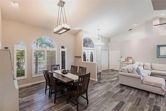 a view of a dining room with furniture window and outside view