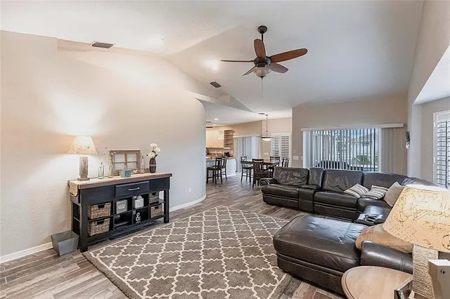 a bedroom with a bed and a ceiling fan