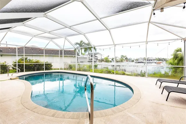 a spacious bedroom with a bed and a window