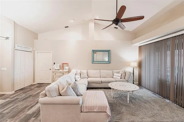 a kitchen with granite countertop a stove sink and refrigerator