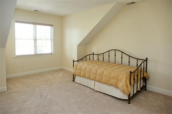 48 Turnberry Road, Unit 48 Bourne, MA 02532 - Photo 11 of 20 a bed sitting in a bedroom next to a window