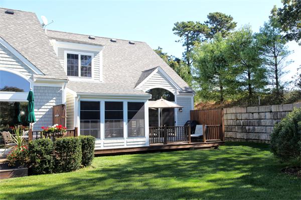48 Turnberry Road, Unit 48 Bourne, MA 02532 - Photo 15 of 20 a view of a house with backyard and porch