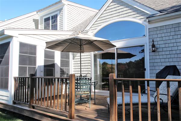 48 Turnberry Road, Unit 48 Bourne, MA 02532 - Photo 17 of 20 a view of a balcony with a potted plant and floor