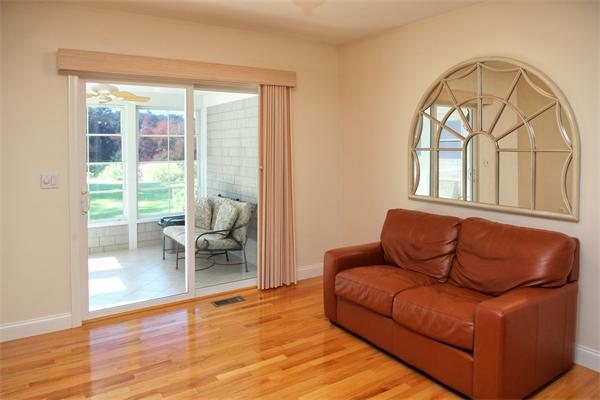 48 Turnberry Road, Unit 48 Bourne, MA 02532 - Photo 7 of 20 a living room with furniture and a large window