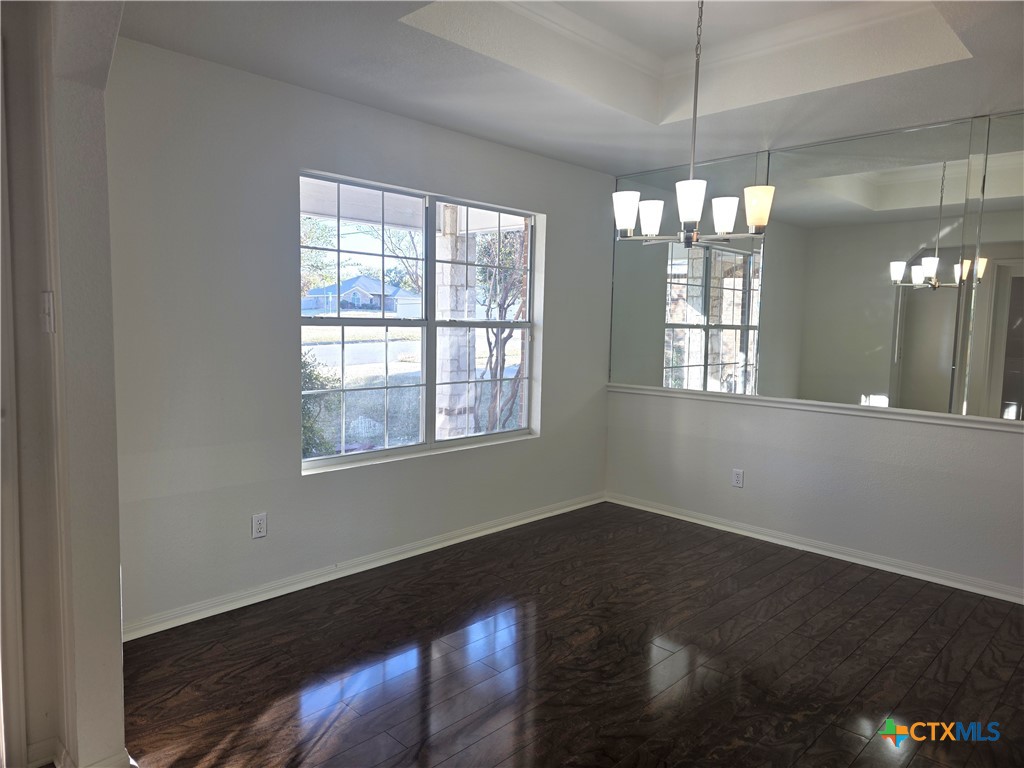 2203 Riley Drive Killeen, TX 76542 - Photo 2 of 22 a view of a room with windows and chandelier