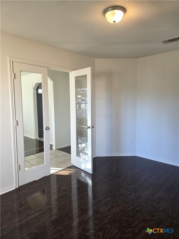 2203 Riley Drive Killeen, TX 76542 - Photo 6 of 22 an empty room with wooden floor and windows
