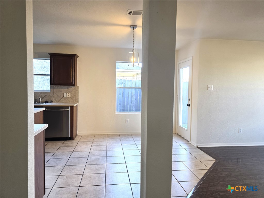 2203 Riley Drive Killeen, TX 76542 - Photo 8 of 22 a kitchen with stainless steel appliances a sink and a stove top oven